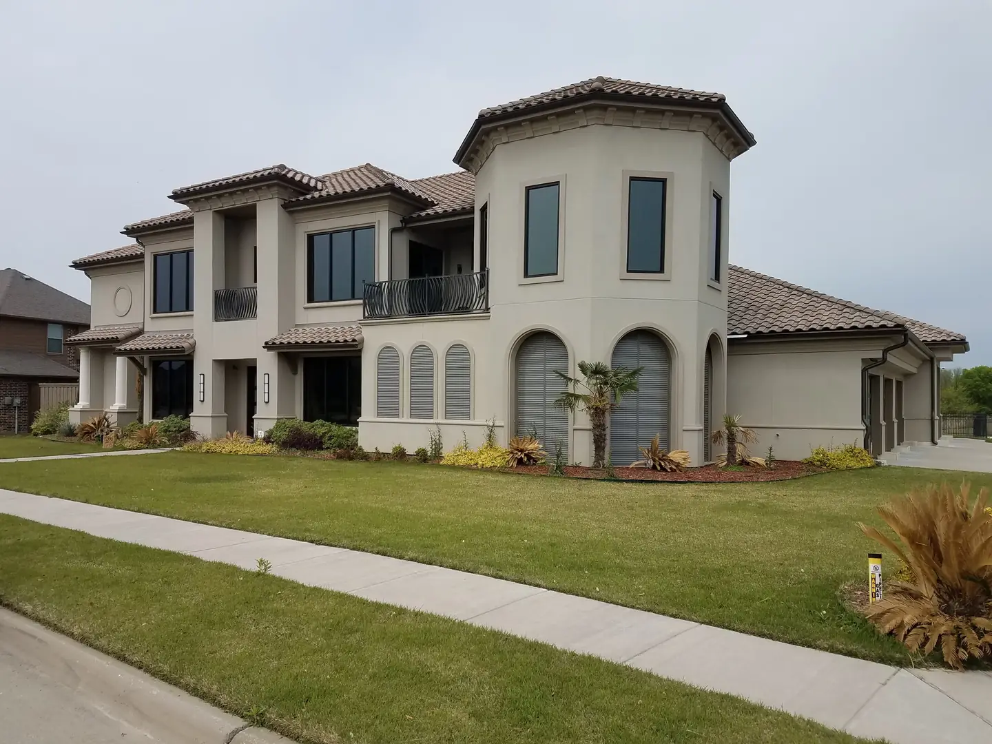 Two story brick home dark solar film windows DFW