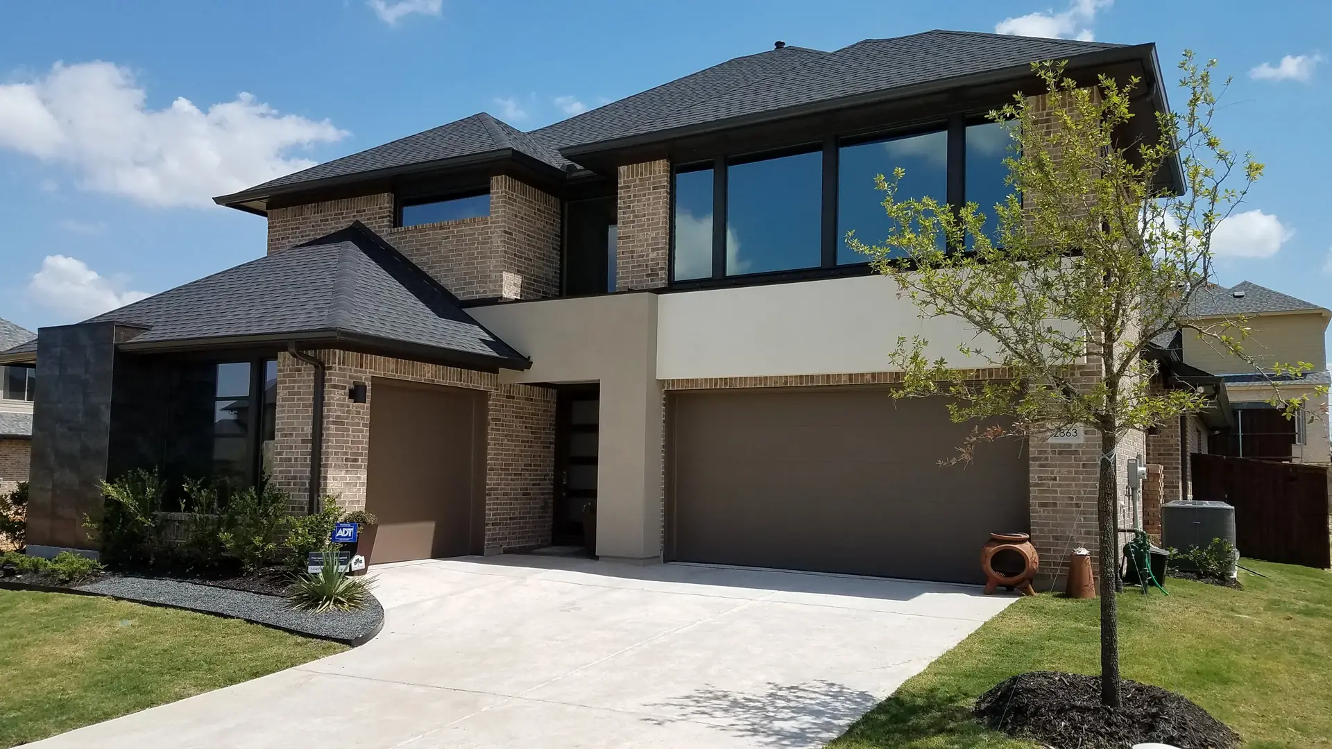Contemporary home dark window film blue sky DFW
