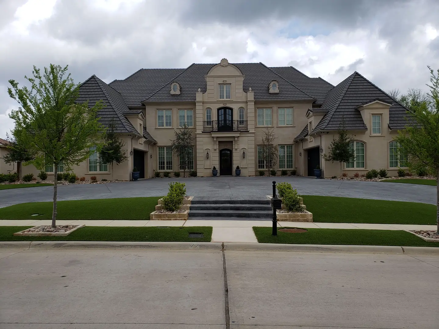 Large Mediterranean estate dark tinted windows DFW