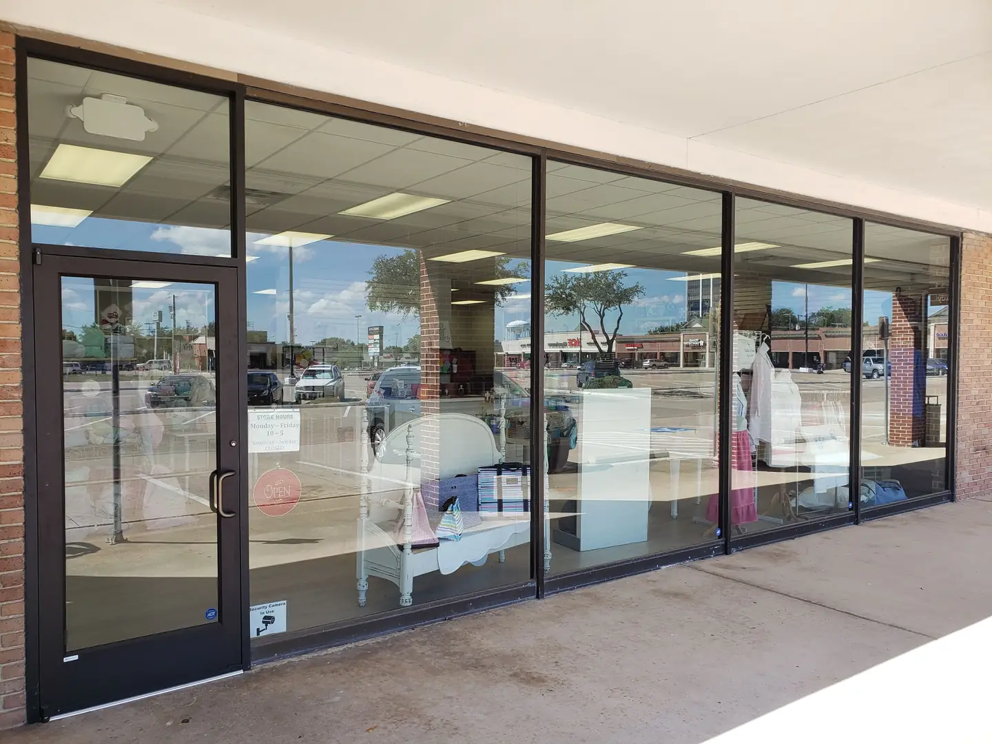 Strip mall storefront dark solar film DFW