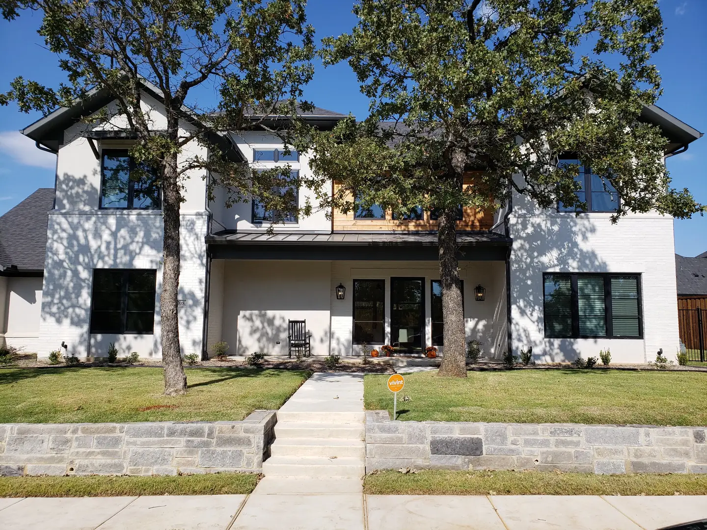 Modern white brick farmhouse black frames dark film DFW