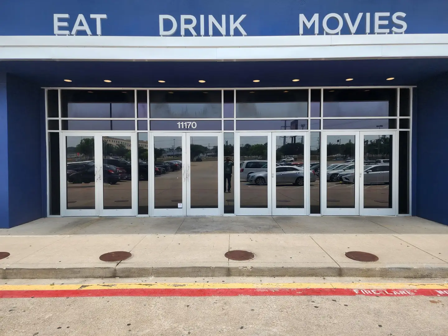 Studio Movie Grill Dallas reflective solar film commercial entry doors DFW