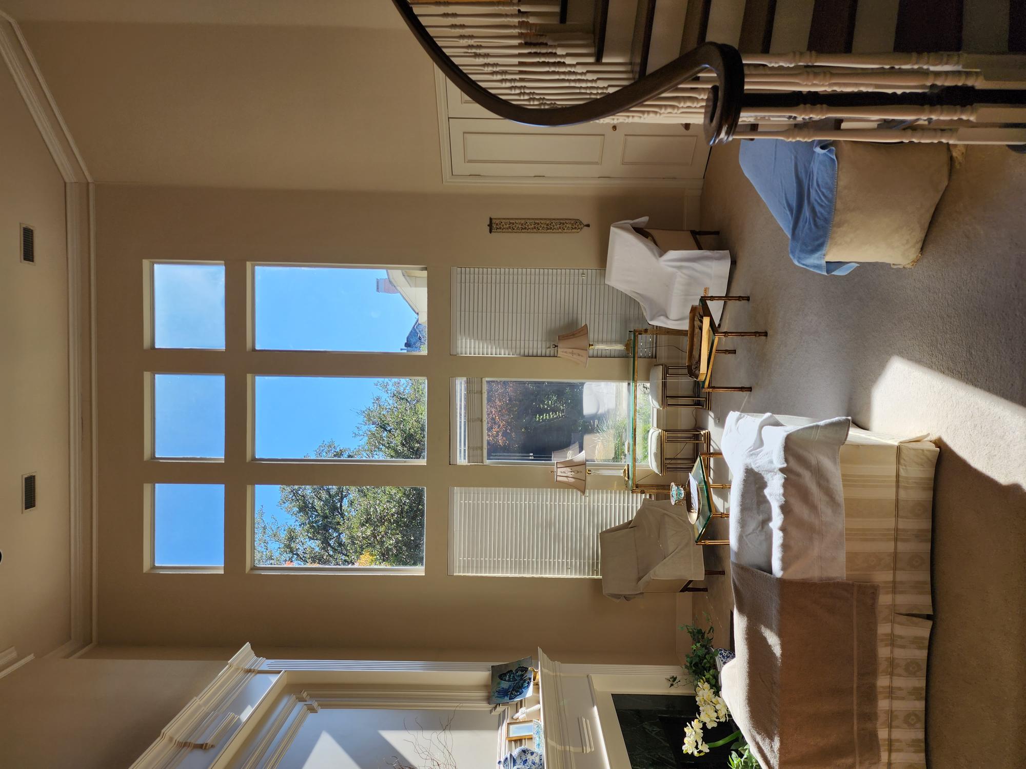 Spanish Mediterranean estate with tile roof and dark windows