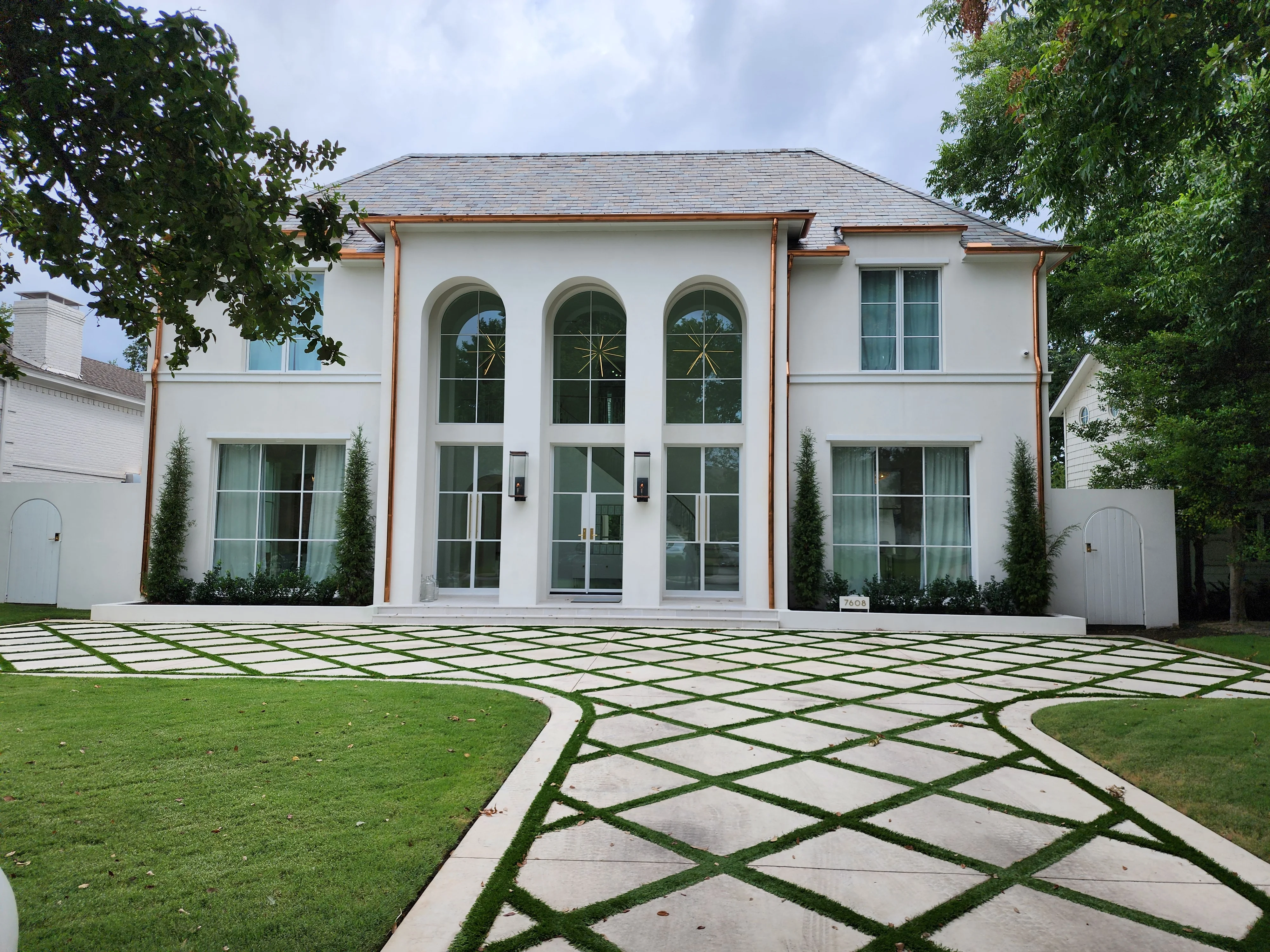 White stucco home copper gutters reflective film Preston Hollow DFW