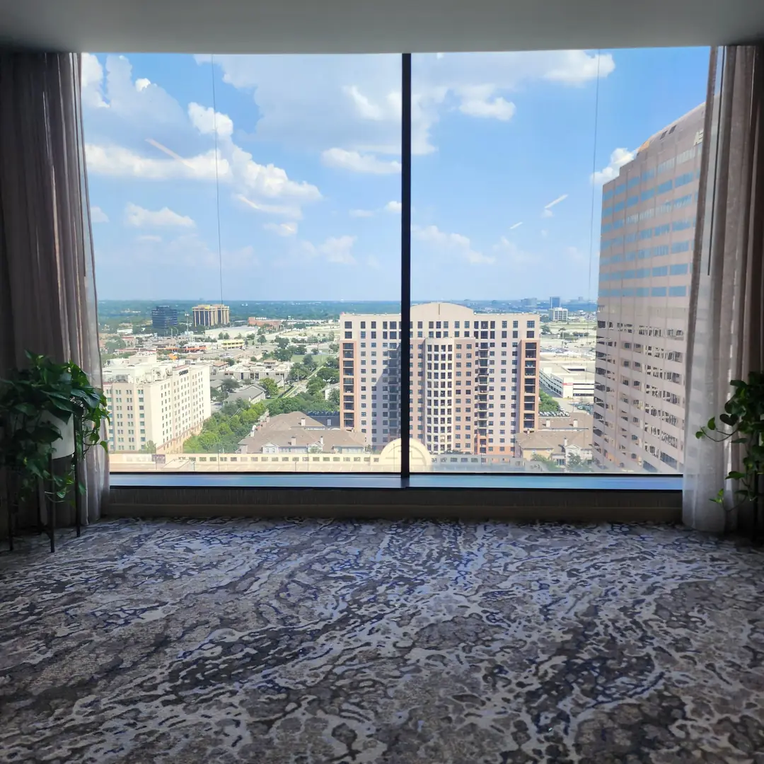 The Westin Galleria Dallas hotel floor-to-ceiling windows city skyline view solar film
