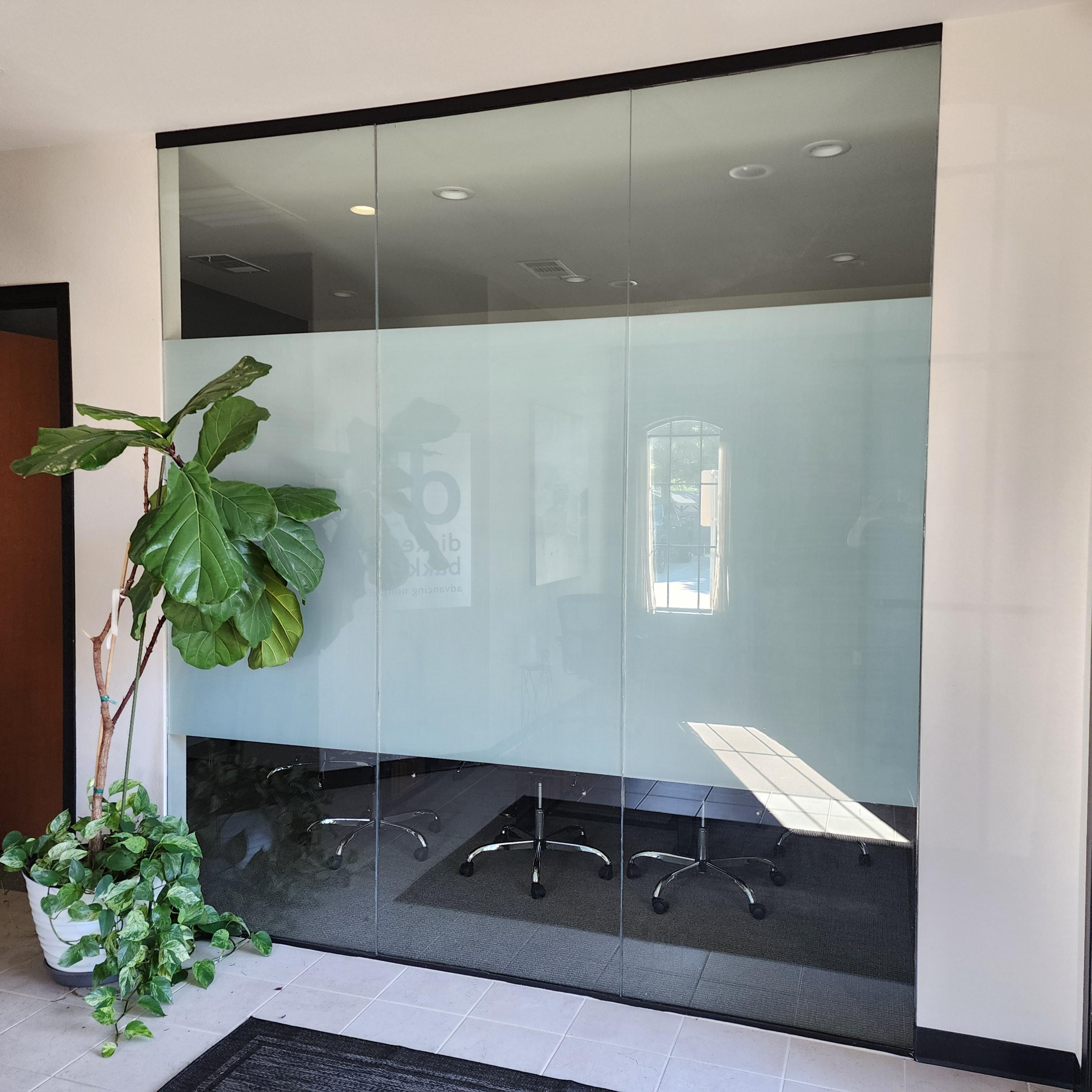 MileX corporate training room after frosted film with branded logo