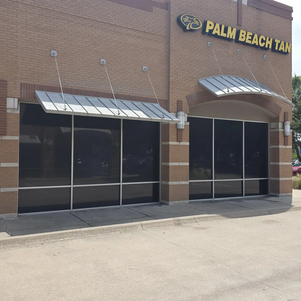 Palm Beach Tan storefront dark blackout window film commercial DFW